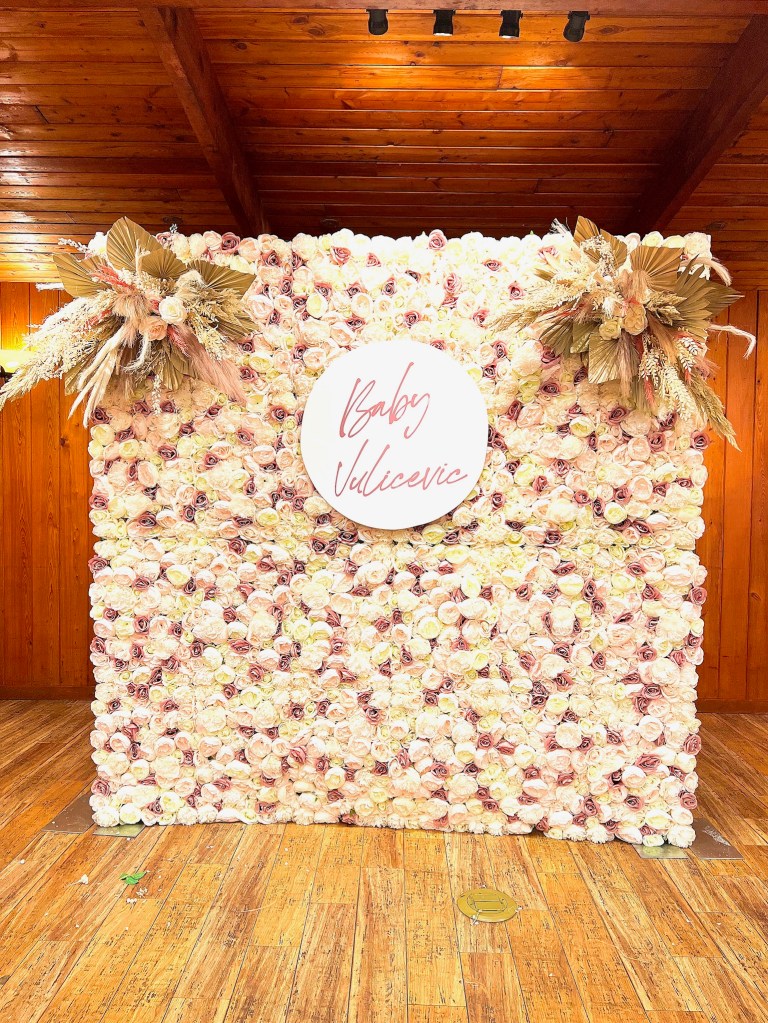 Boho inspired baby girl themed. With Blush rose and white rose flower wall paired with two blush boho floral arrangements. 